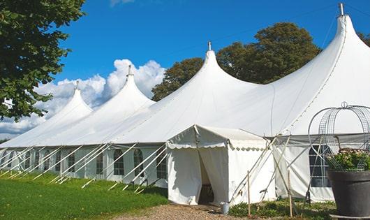 a line of sleek and modern portable toilets ready for use at an upscale corporate event in Mettawa